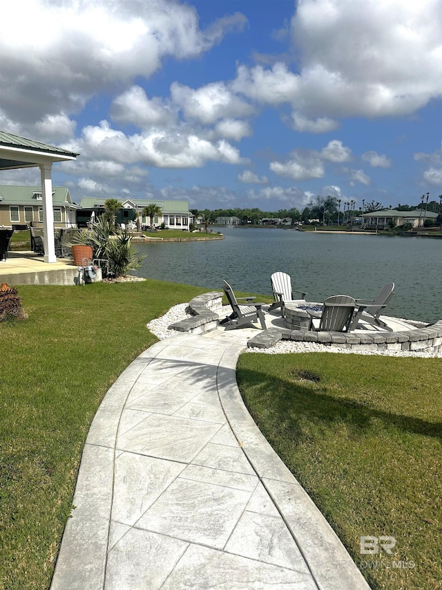 property view of water featuring an outdoor fire pit