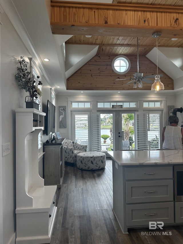 kitchen featuring dark wood finished floors, french doors, decorative light fixtures, beam ceiling, and high vaulted ceiling