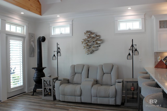 living area with recessed lighting, wood finished floors, and a healthy amount of sunlight