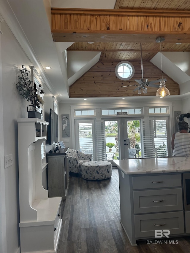 kitchen featuring dark wood-style floors, beamed ceiling, gray cabinetry, high vaulted ceiling, and hanging light fixtures