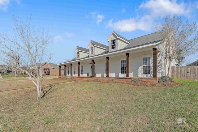 view of front facade featuring covered porch and a front lawn