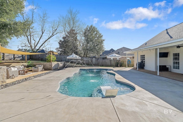 view of swimming pool with a patio area, an outdoor living space, and pool water feature