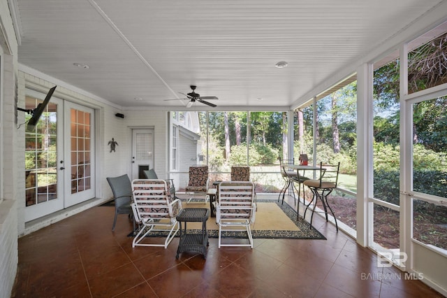 sunroom featuring french doors and ceiling fan