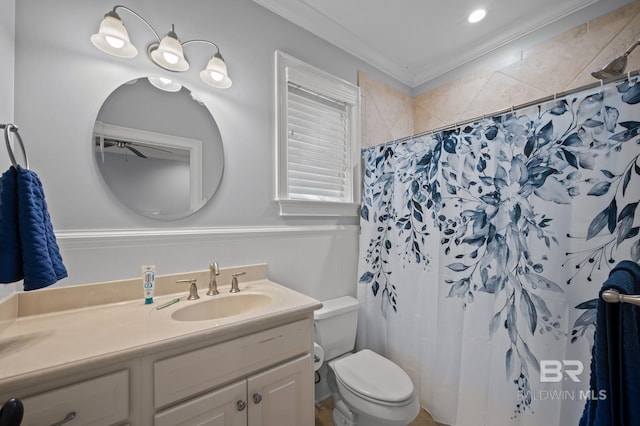 bathroom featuring curtained shower, vanity, ornamental molding, and toilet