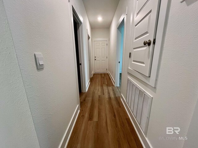 11006 Secretariat Blvd, Daphne, AL 36526 - corridor featuring dark wood-style flooring, baseboards, and a textured wall