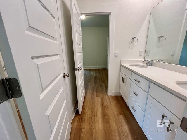 11006 Secretariat Blvd, Daphne, AL 36526 - bathroom with wood finished floors, double vanity, and baseboards
