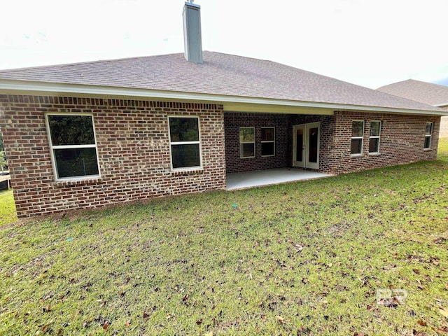 11006 Secretariat Blvd, Daphne, AL 36526 - back of property with roof with shingles, a yard, a patio area, and brick siding