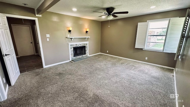 unfurnished living room featuring beamed ceiling, a textured ceiling, carpet floors, and ceiling fan