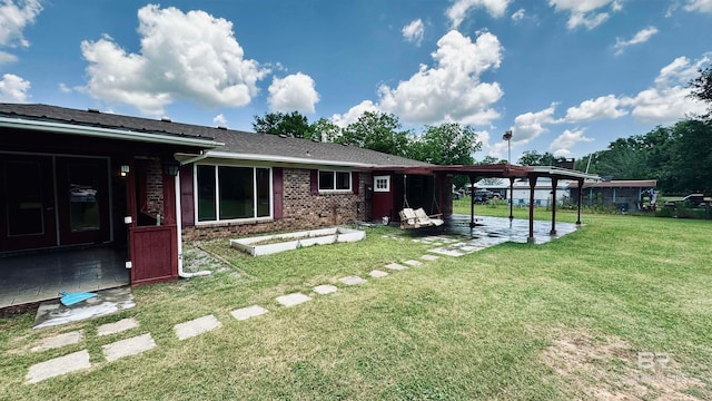 back of house featuring a yard