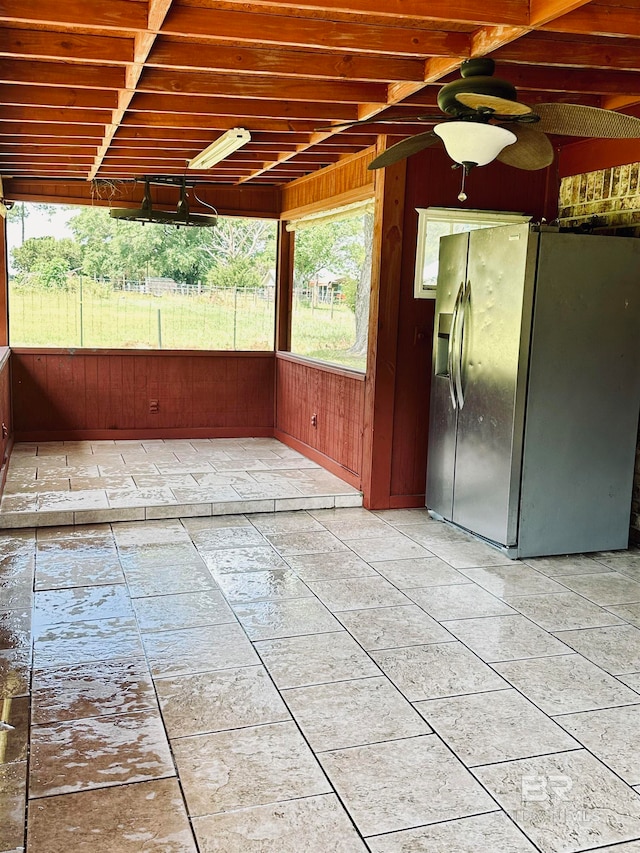 unfurnished room featuring tile flooring