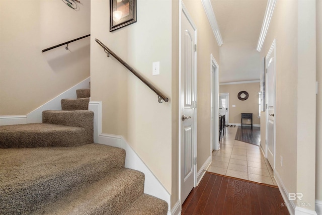 267 Galaxy St, Fairhope, AL 36532 - stairway featuring baseboards, wood finished floors, and crown molding
