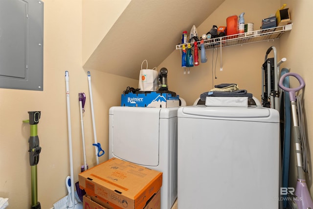 washroom with washing machine and clothes dryer and electric panel