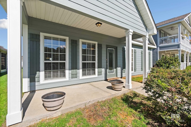 back of property with a balcony