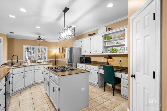 kitchen featuring a kitchen island, sink, black appliances, crown molding, and white cabinets