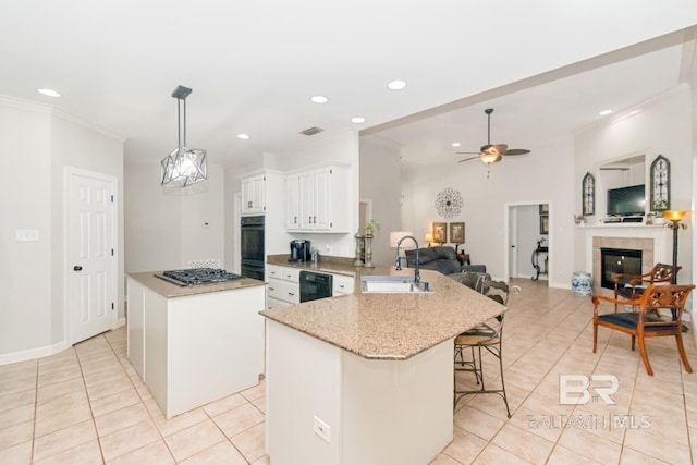 8814 N Dawes Lake Rd, Mobile, AL 36619 - kitchen featuring light tile patterned floors, ornamental molding, a peninsula, and a sink