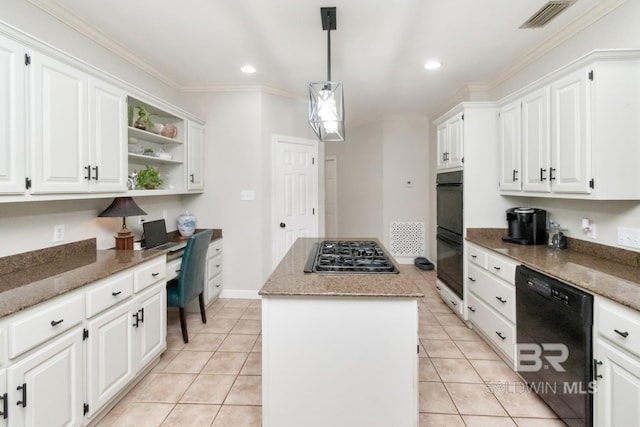 8814 N Dawes Lake Rd, Mobile, AL 36619 - kitchen with built in desk, a center island, white cabinets, visible vents, and black appliances