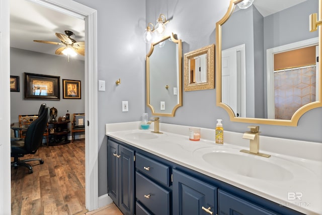 bathroom featuring vanity, hardwood / wood-style flooring, and ceiling fan