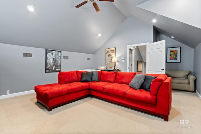 living room featuring ceiling fan, vaulted ceiling, and light colored carpet