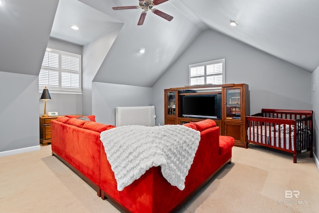 carpeted bedroom featuring vaulted ceiling and ceiling fan