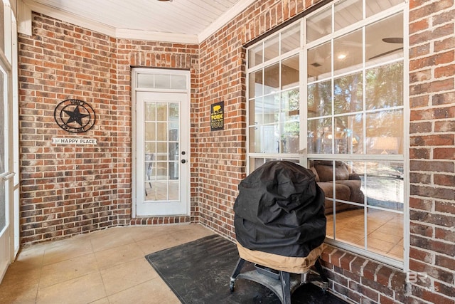 8814 N Dawes Lake Rd, Mobile, AL 36619 - doorway to property with brick siding and a porch