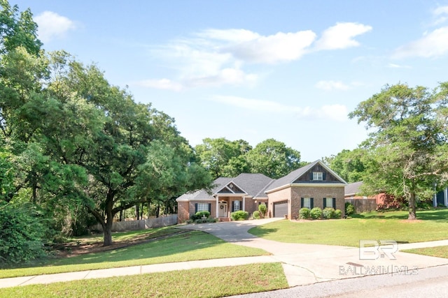 8814 N Dawes Lake Rd, Mobile, AL 36619 - view of front of house featuring a front yard, driveway, a garage, and fence