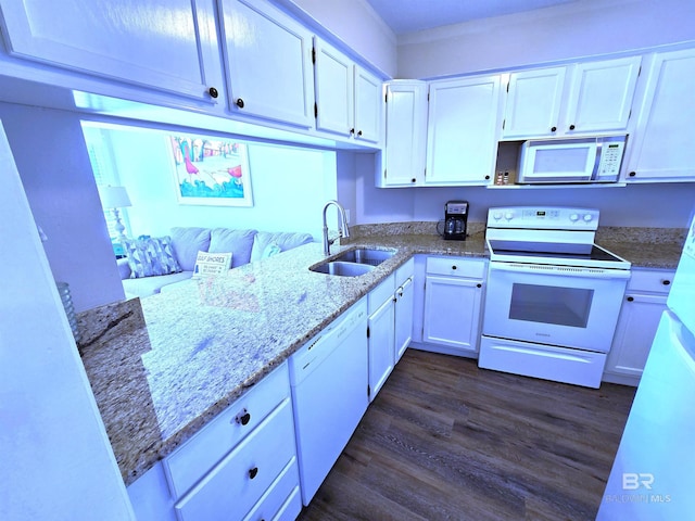 kitchen with white cabinetry, sink, and white appliances