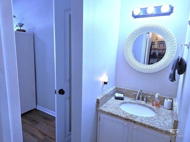 bathroom with vanity and wood-type flooring