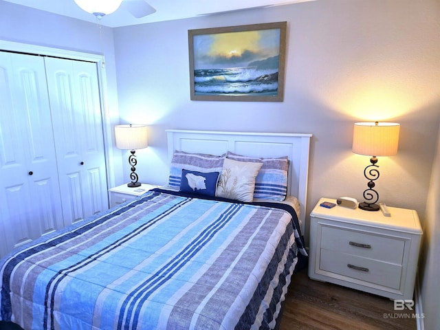 bedroom featuring dark hardwood / wood-style floors, a closet, and ceiling fan