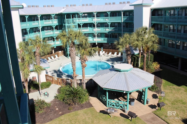 view of swimming pool with a gazebo and a patio area