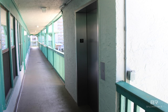 corridor featuring elevator