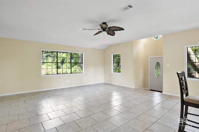 18657 County Road 12, Foley, AL 36535 - spare room with a ceiling fan, healthy amount of natural light, baseboards, light tile patterned floors, and lofted ceiling