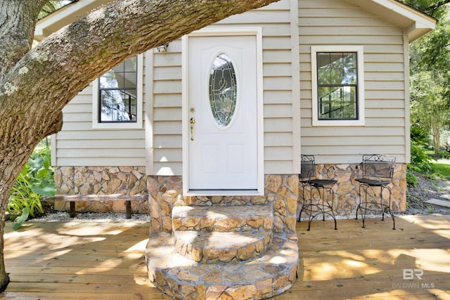 18657 County Road 12, Foley, AL 36535 - property entrance featuring a wooden deck and stone siding
