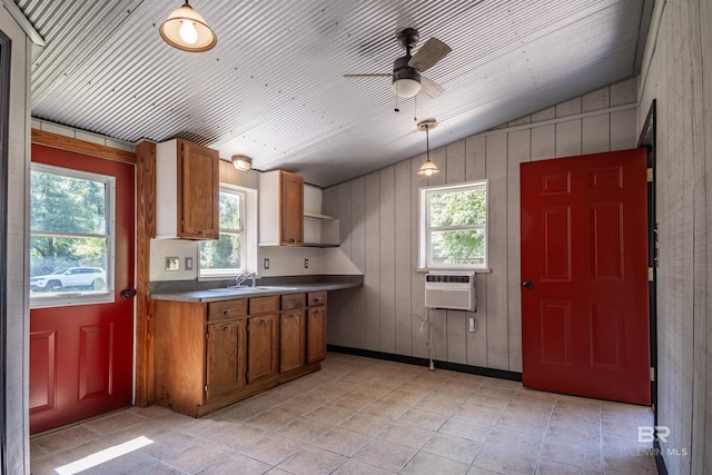 18657 County Road 12, Foley, AL 36535 - kitchen featuring vaulted ceiling, a sink, healthy amount of natural light, ceiling fan, and brown cabinetry