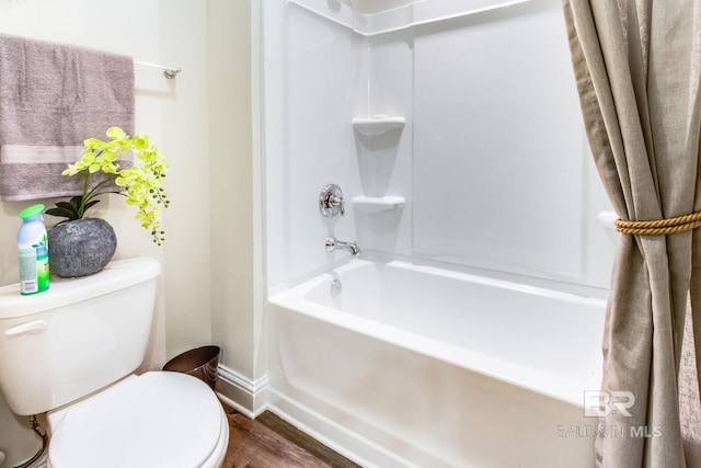 11547 Thistledown Loop, Spanish Fort, AL 36527 - bathroom with shower / washtub combination, toilet, wood finished floors, and baseboards