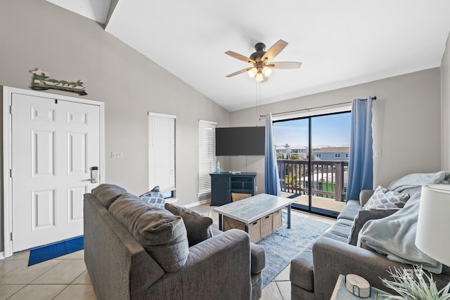 tiled living room with ceiling fan and lofted ceiling