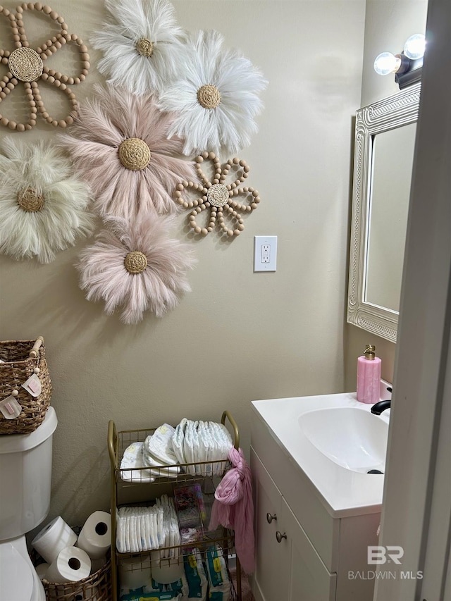 bathroom featuring toilet and vanity