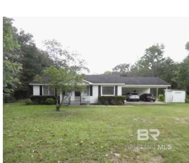 ranch-style home with a carport and a front lawn