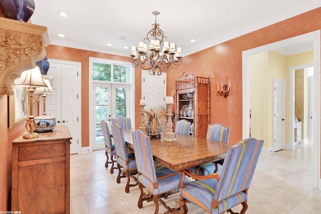 dining room with french doors, ornamental molding, and a notable chandelier