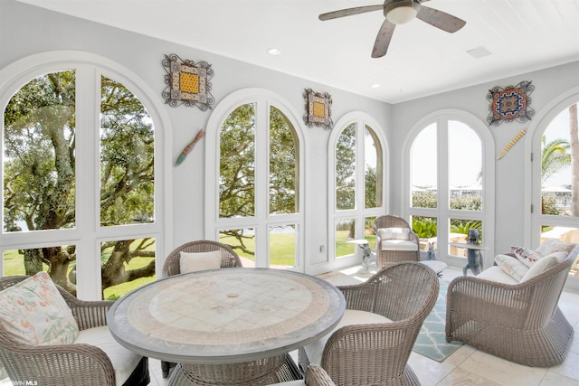 sunroom with ceiling fan and a wealth of natural light