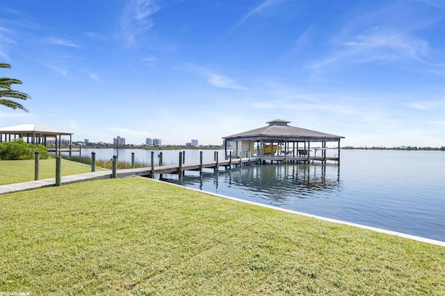 dock area featuring a yard and a water view