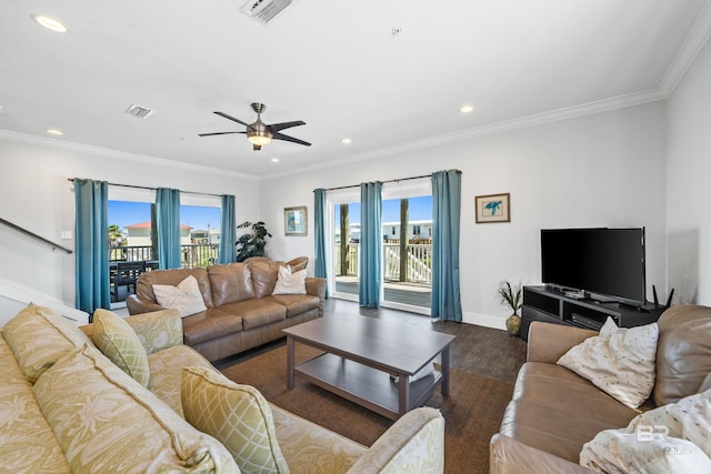 living room featuring ornamental molding, ceiling fan, and dark wood-type flooring