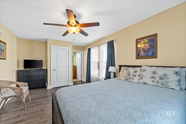 bedroom with ceiling fan and dark wood-type flooring