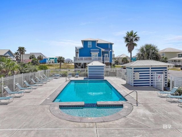 view of pool featuring an outdoor structure and a patio