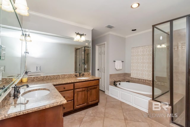 306 Thornton Pl, Mobile, AL 36609 - bathroom with ornamental molding, a garden tub, tile patterned floors, double vanity, and a stall shower