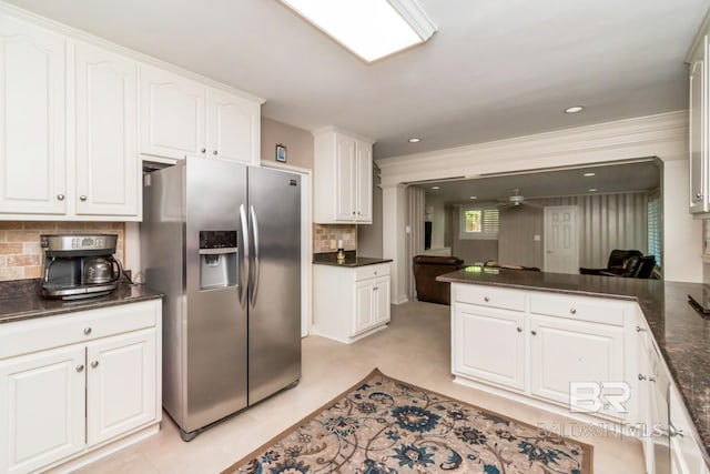306 Thornton Pl, Mobile, AL 36609 - kitchen featuring stainless steel fridge, dark countertops, white cabinetry, backsplash, and a peninsula