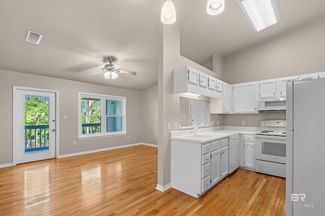 kitchen featuring light countertops, white appliances, visible vents, and white cabinets