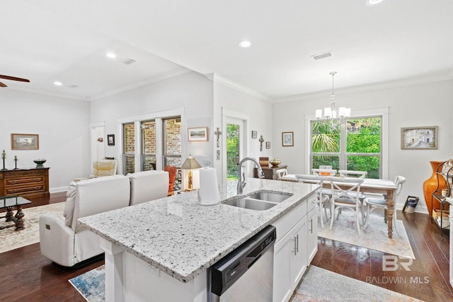 kitchen featuring pendant lighting, dishwasher, a center island with sink, sink, and white cabinetry