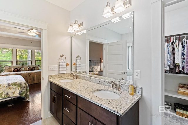 bathroom featuring hardwood / wood-style flooring, vanity, and ceiling fan