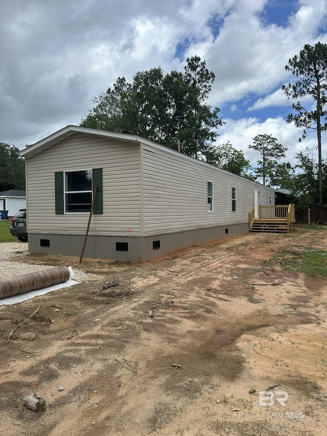 9312 Bay Pines Rd, Elberta, AL 36530 - view of home's exterior featuring crawl space and a wooden deck