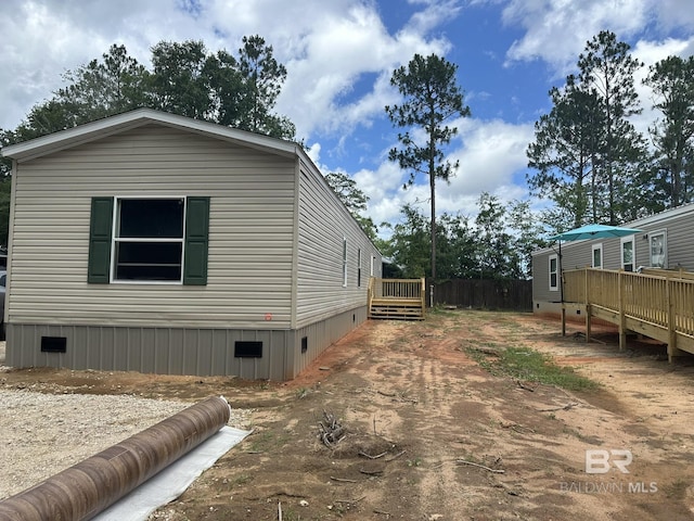 9312 Bay Pines Rd, Elberta, AL 36530 - view of home's exterior with a wooden deck and crawl space